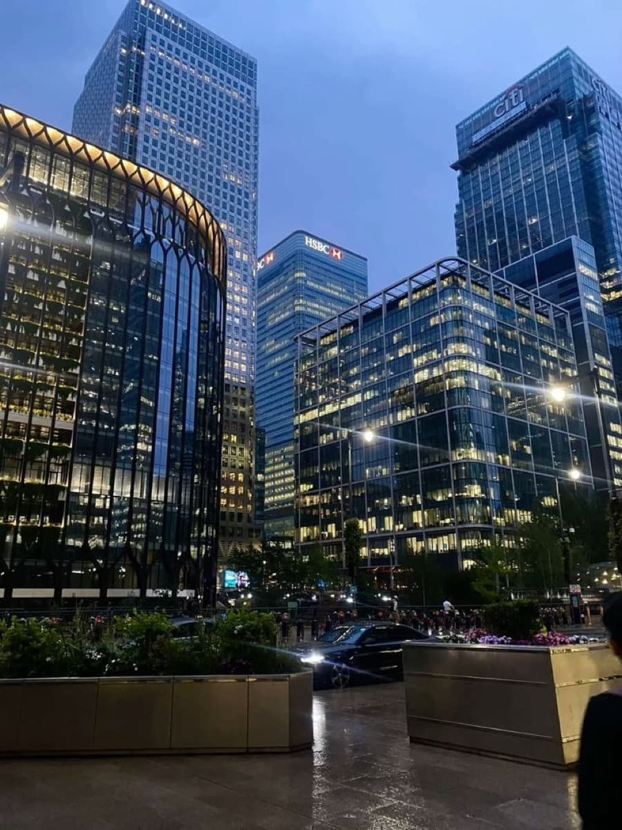 London city skyline at night with illuminated modern office buildings