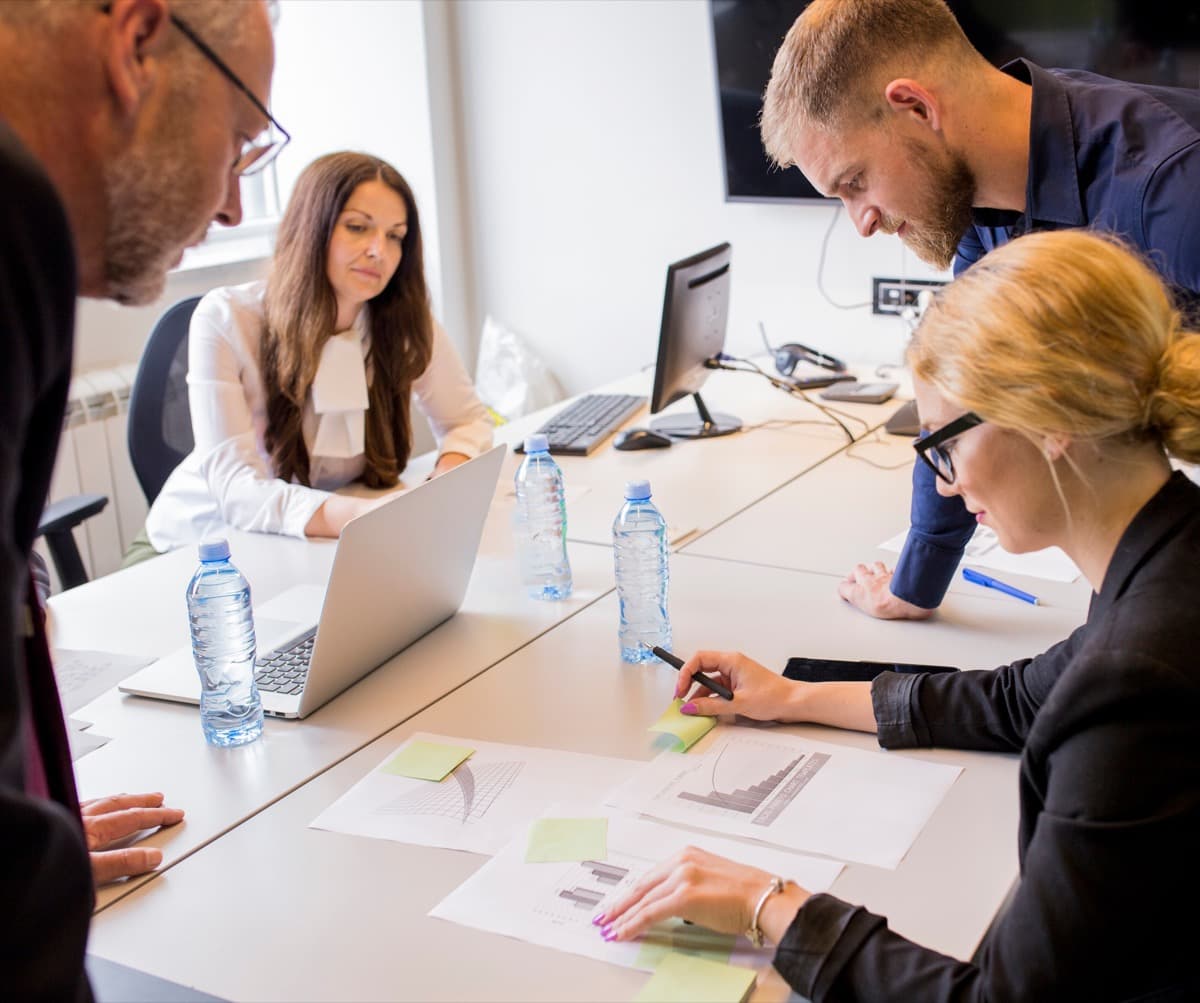 Team collaborating in a bright, professionally managed group accommodation space