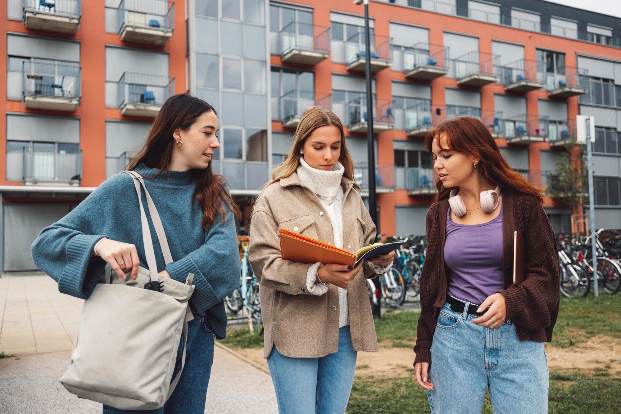Students talking together outdoors near campus accommodation