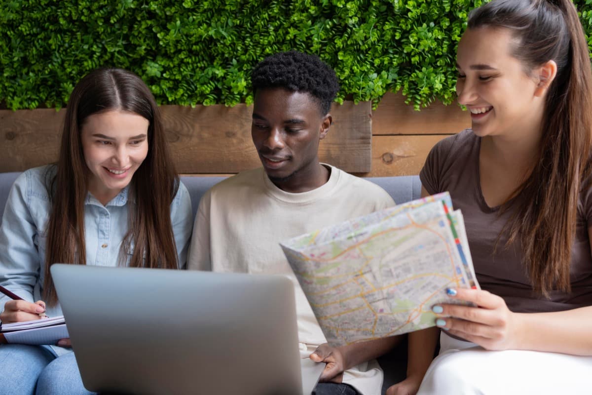 Students planning local travel using a map at their accommodation