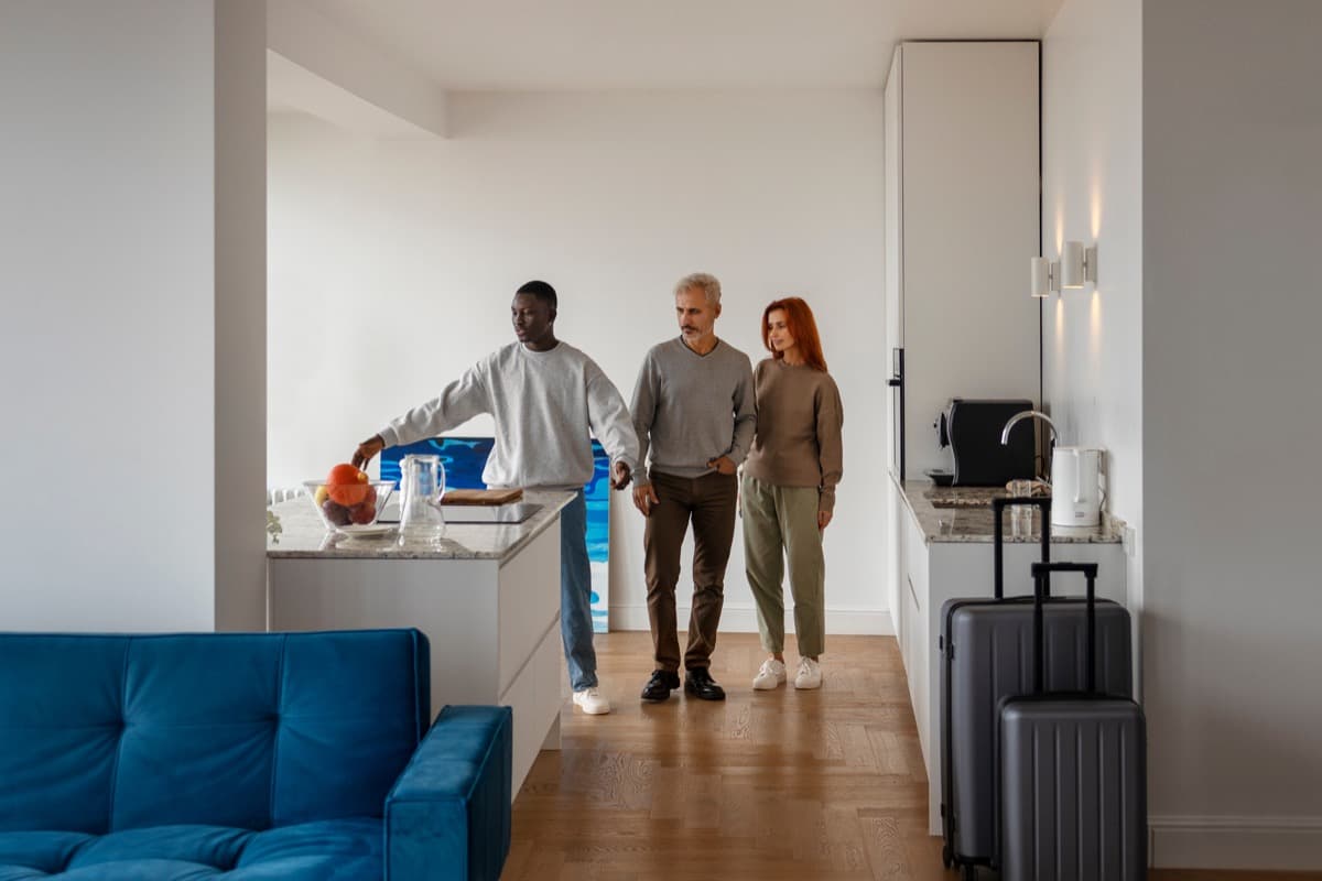 Relocating employees gathering in a modern apartment living area