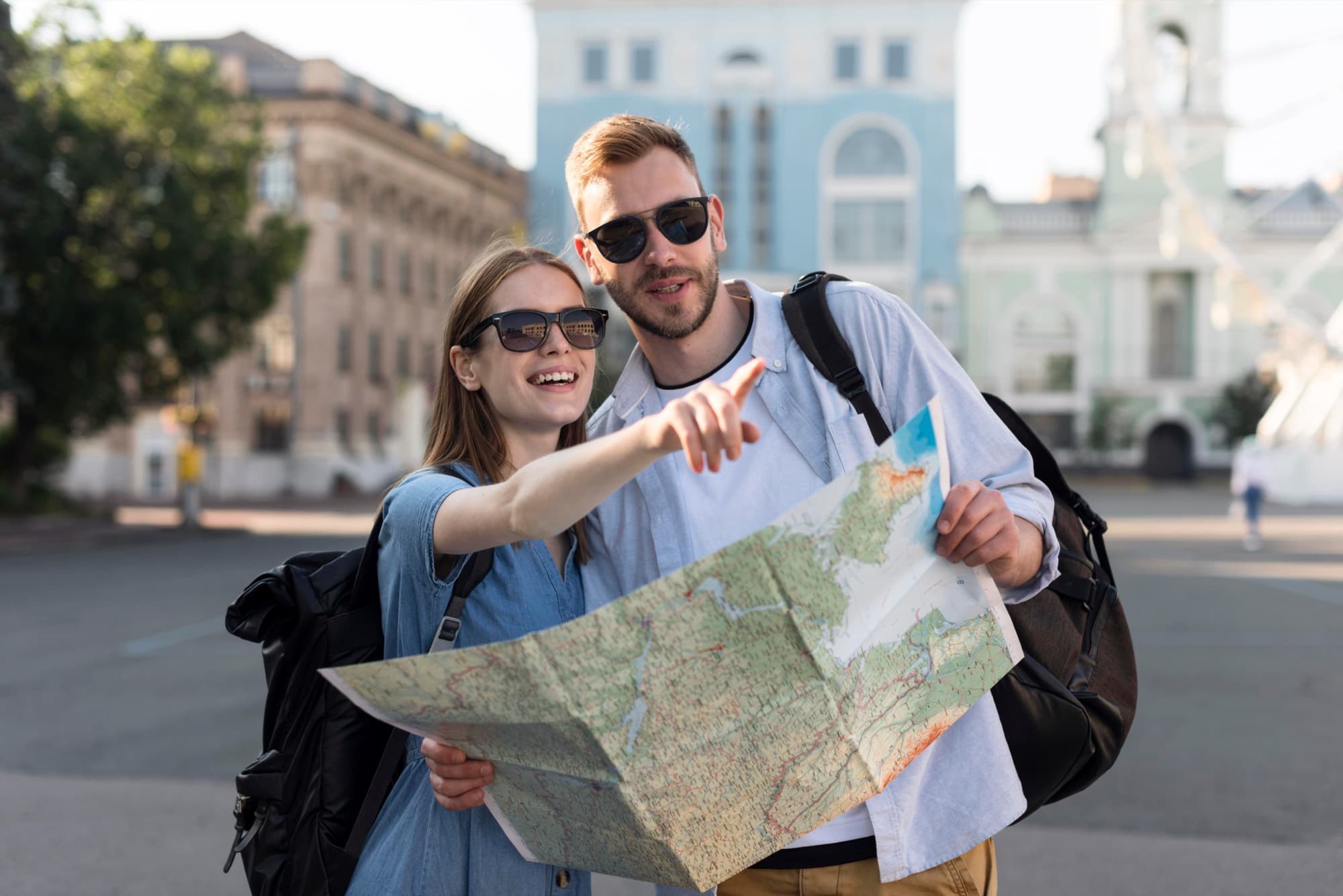 Travellers planning local tours and experiences with a city map