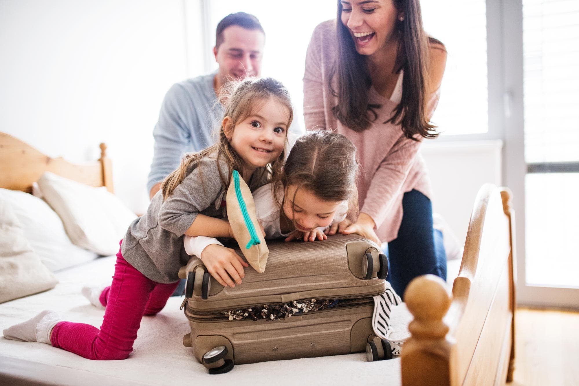 Family packing together for a stay in furnished accommodation