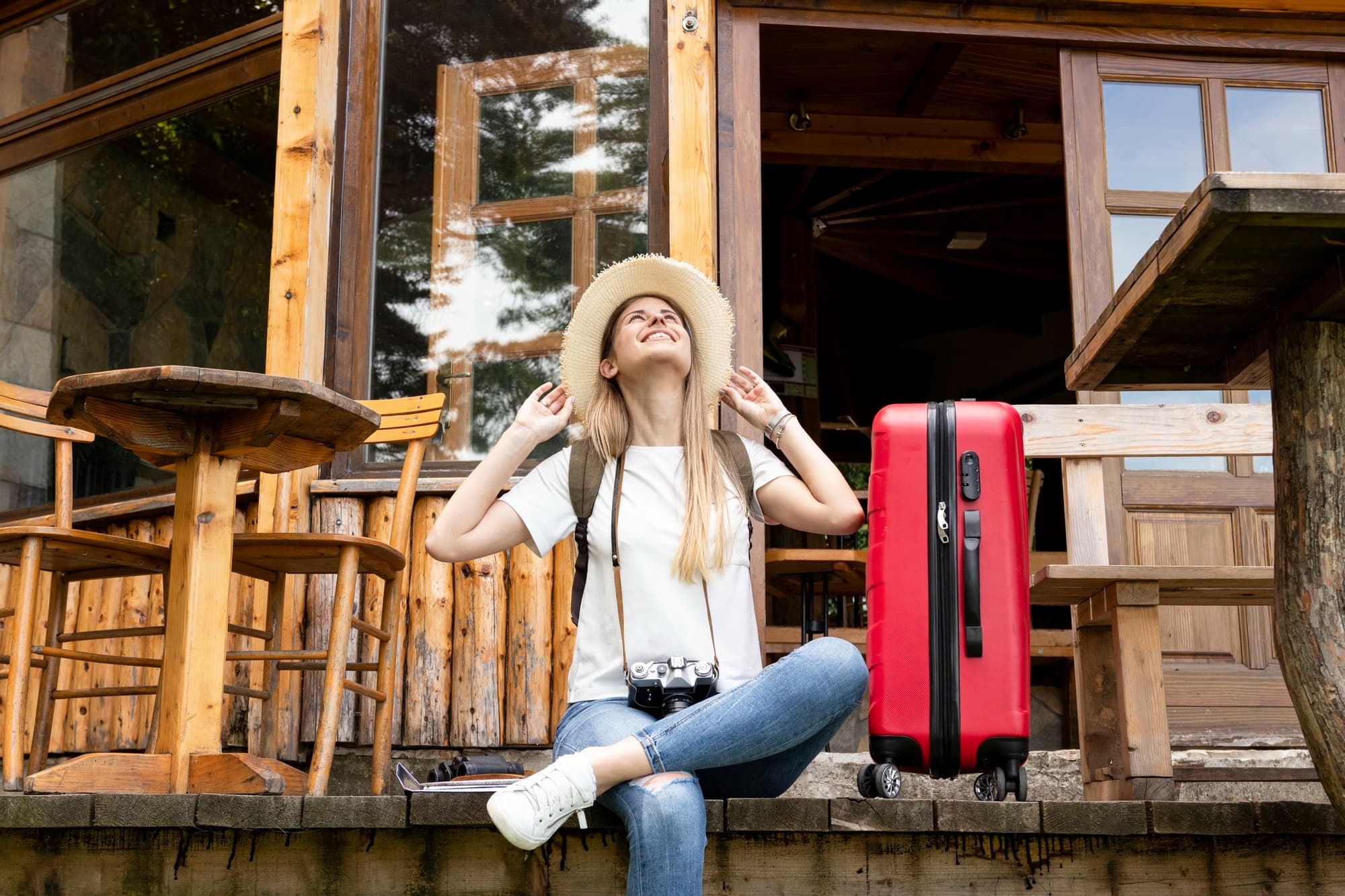 Traveller with luggage arriving at holiday accommodation