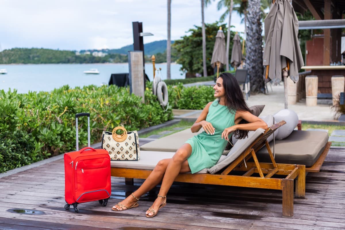 Guest relaxing by a pool at holiday accommodation with outdoor amenities