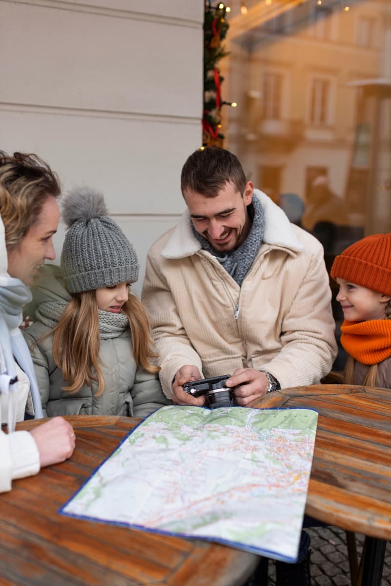 Family using a map to explore local attractions near their holiday stay