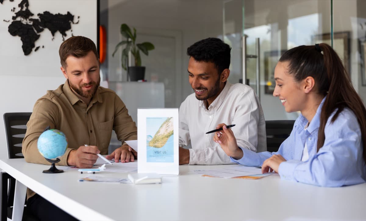 Travel agents reviewing holiday booking reports and documentation