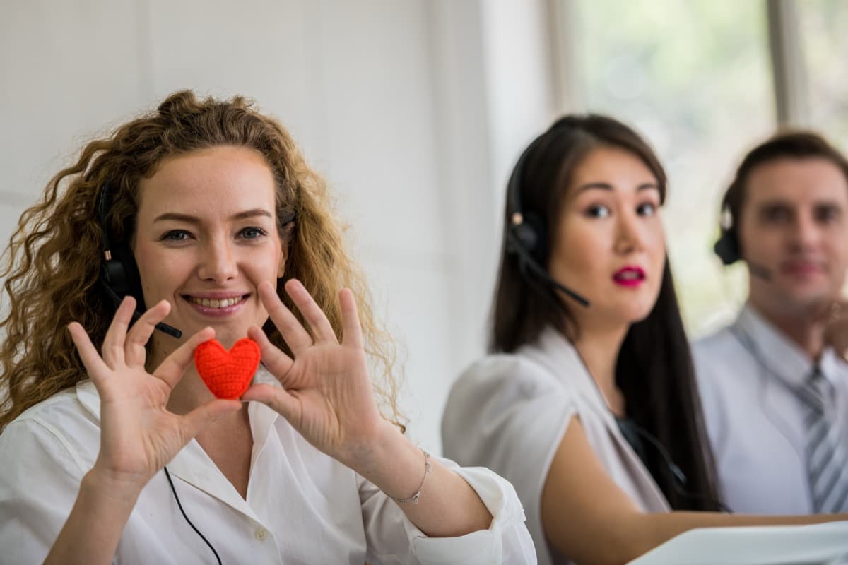HR professional holding a heart symbol representing employee duty of care