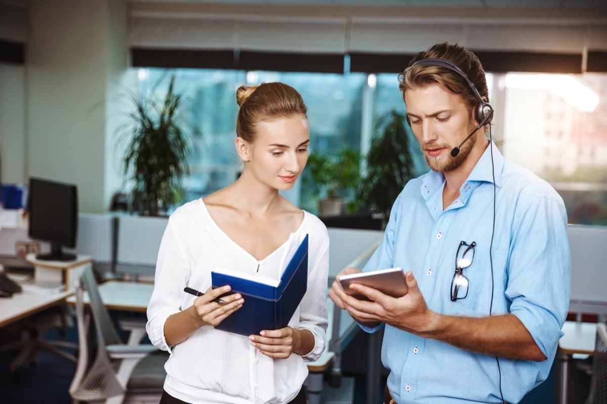 Insurance coordinator and property provider reviewing claim accommodation details