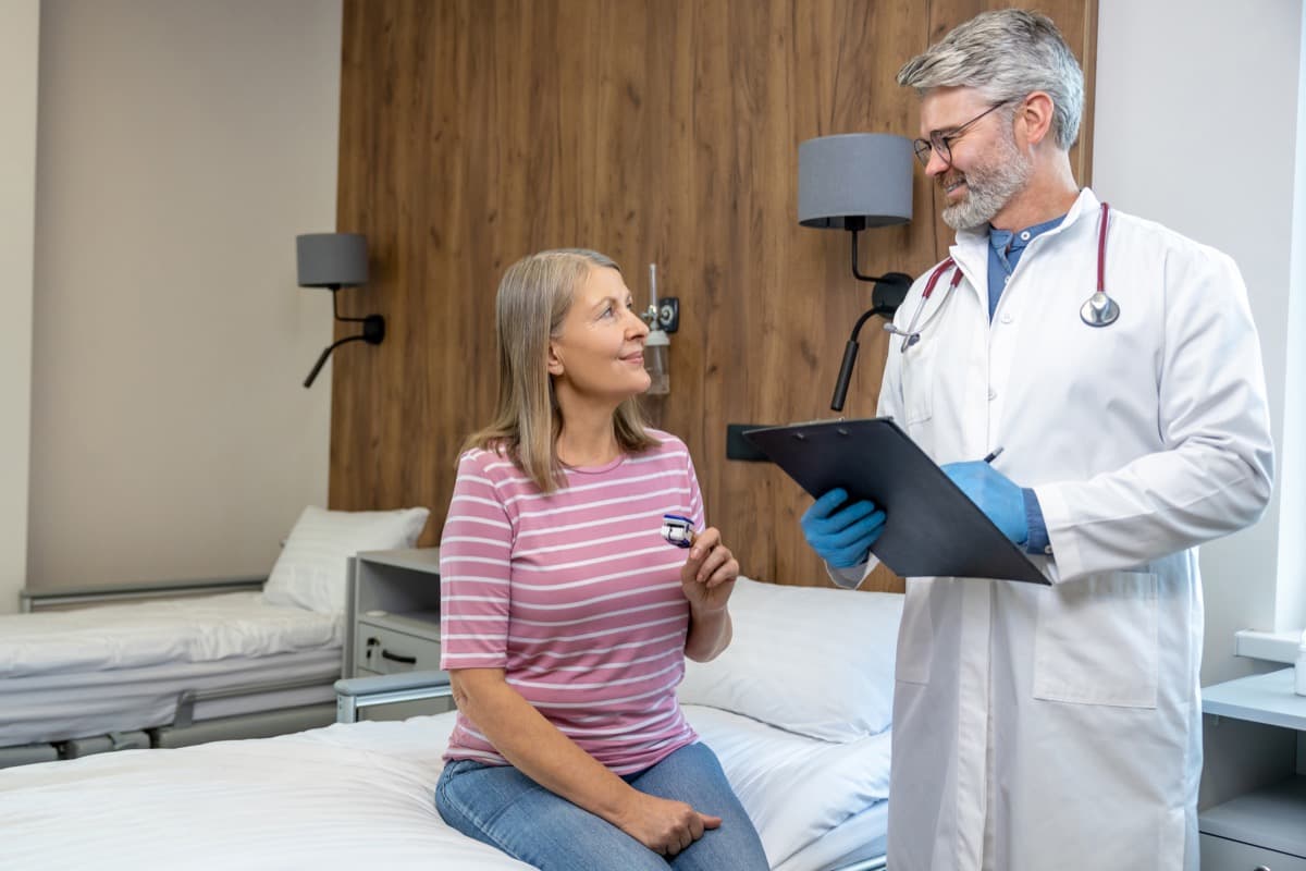 Healthcare professional consulting with a patient in a medical stay apartment