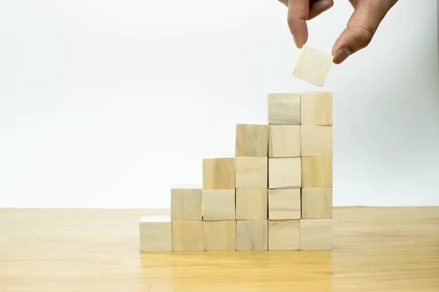 Wooden blocks being stacked to form steps