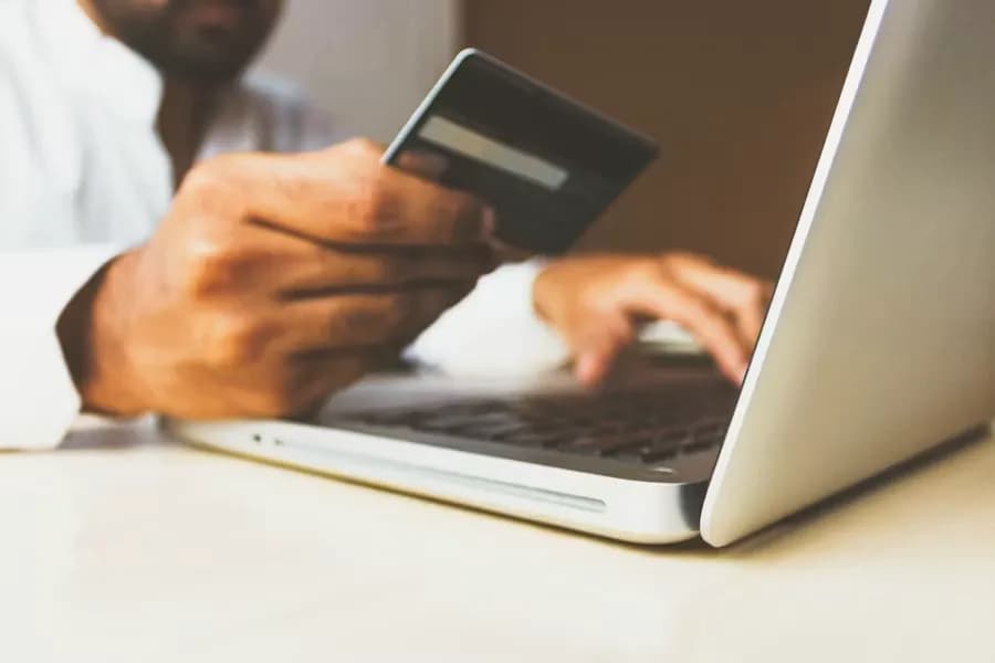 Making a payment with a card while using a laptop
