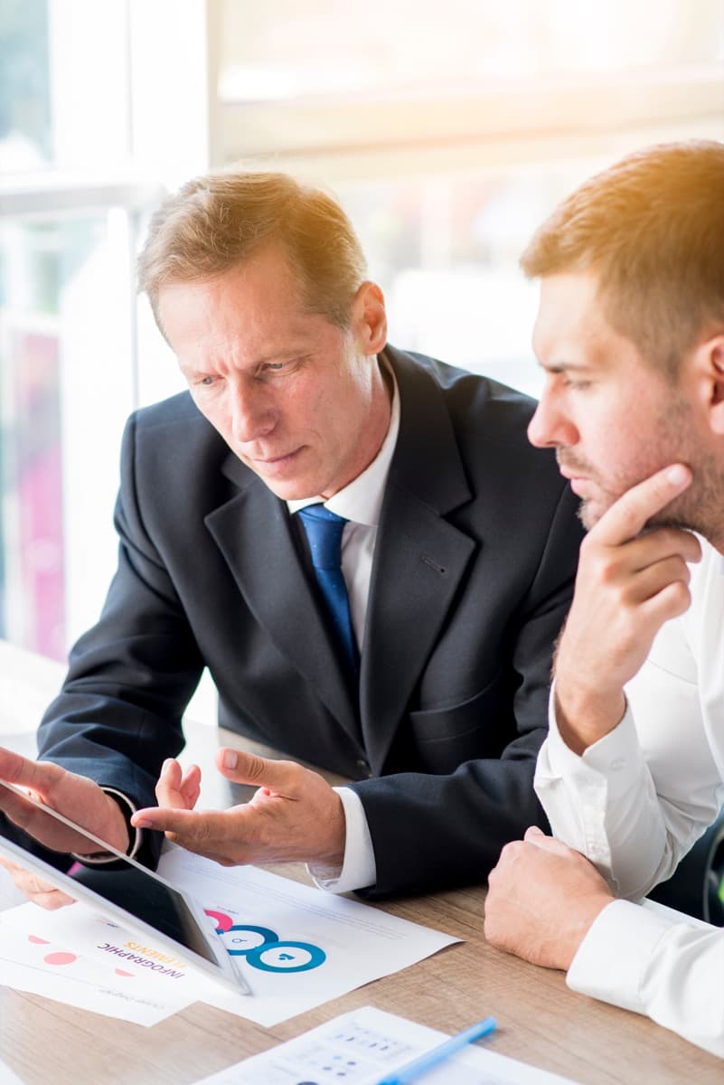 Relocation specialist reviewing negotiated accommodation rates on a tablet